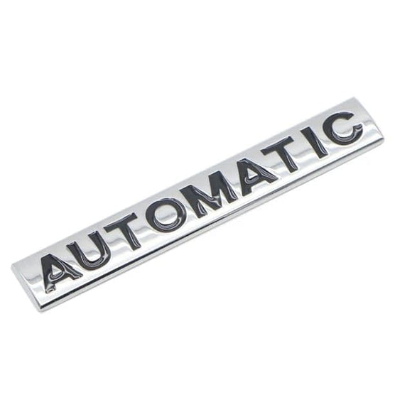 AutoBizarre 3D Raised Silver Black Automatic Metal Monogram Emblem Badge Sticker for All Cars & Bikes