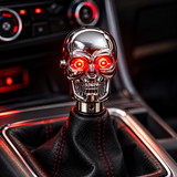 AutoBizarre Silver Chrome Metal Skull Shaped Gear Shift Knob with Red Illuminated Eyes LED Lights Universal for All Cars