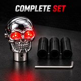 AutoBizarre Silver Chrome Metal Skull Shaped Gear Shift Knob with Red Illuminated Eyes LED Lights Universal for All Cars